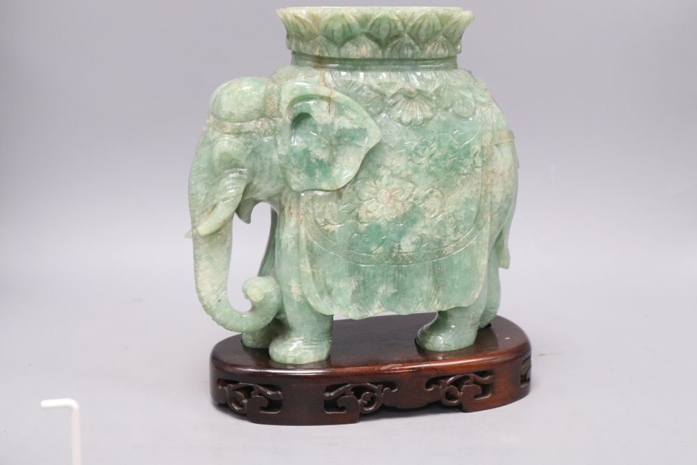 A large Chinese stone carving of elephant, with wood stand, overall 26cm
